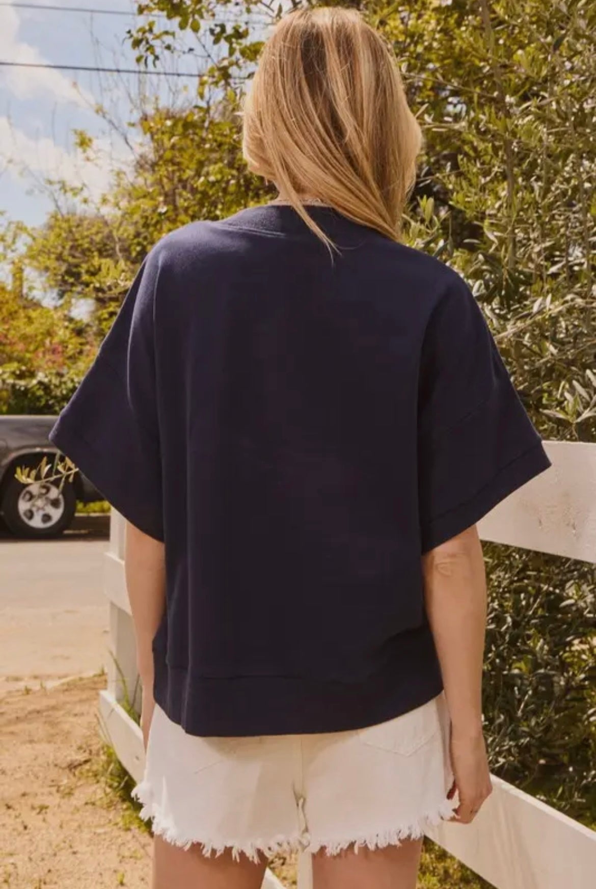 Navy short sleeve sweatshirt with orange “A”