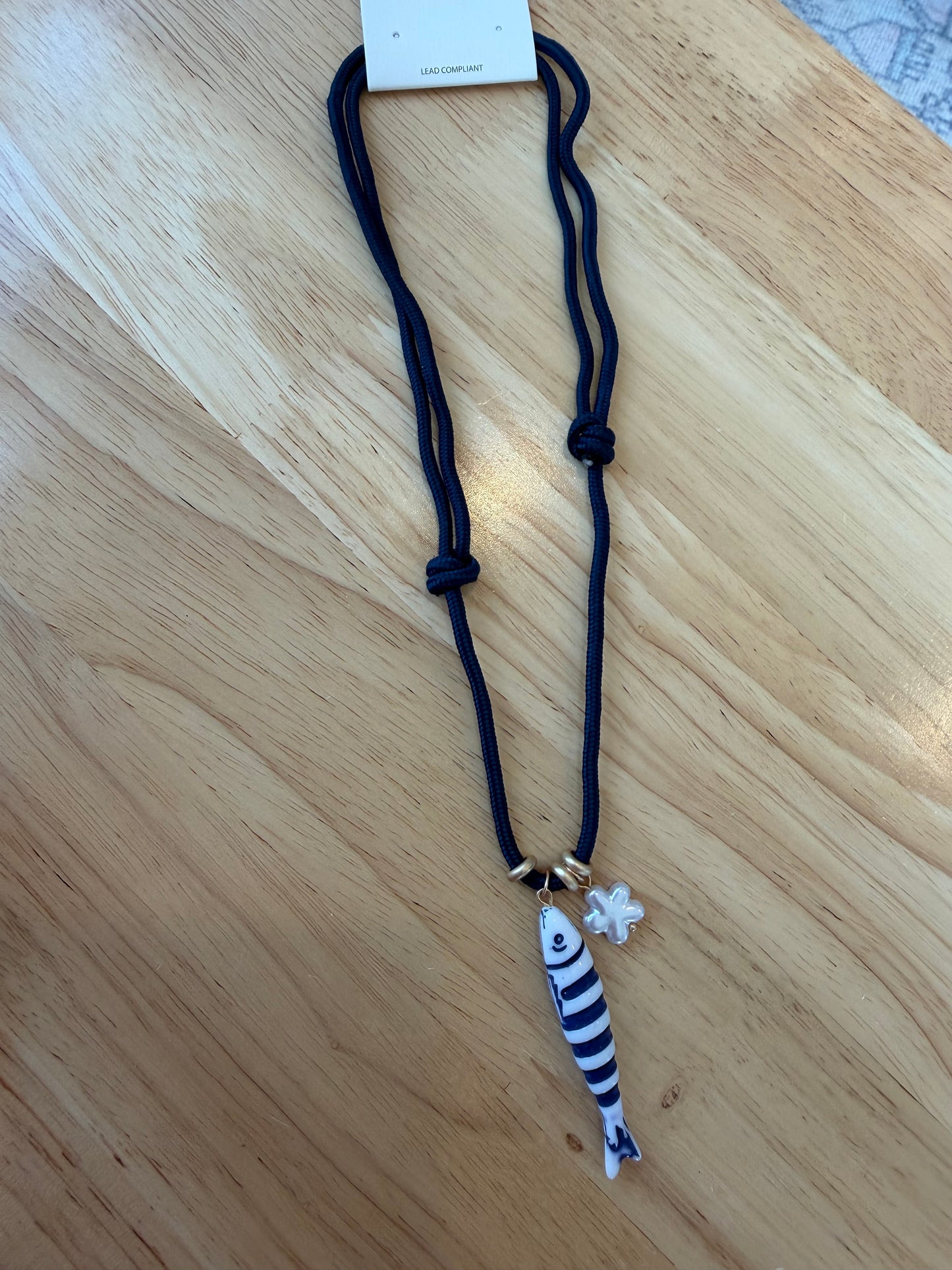 Fish on cord necklace