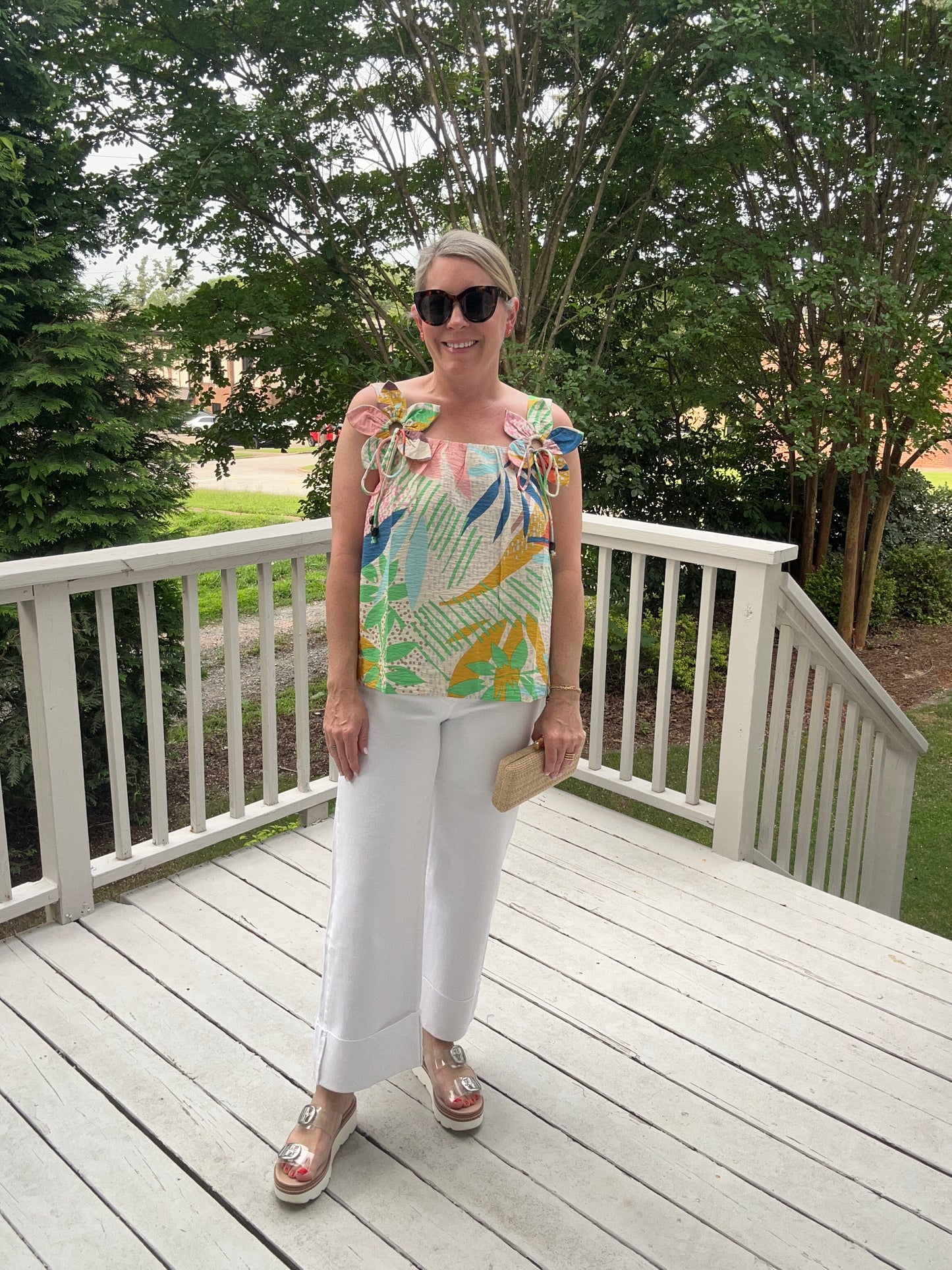 Tropical printed sleeveless top with flower detail