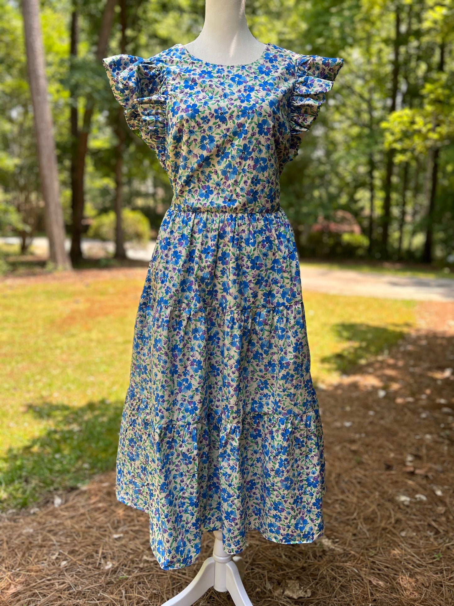 Ruffled shoulder dress by English Factory. Open back detail.