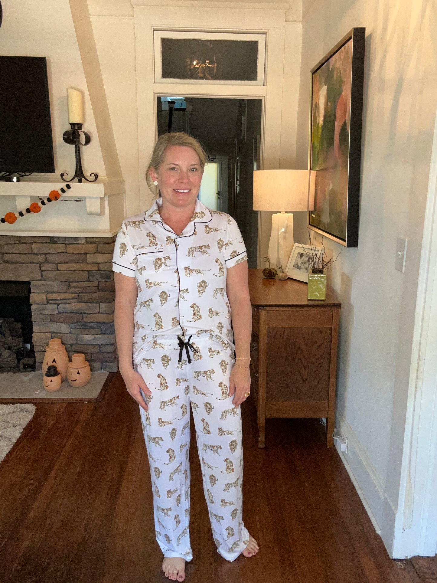 Button-up short sleeve top and pant pajama set with tigers.