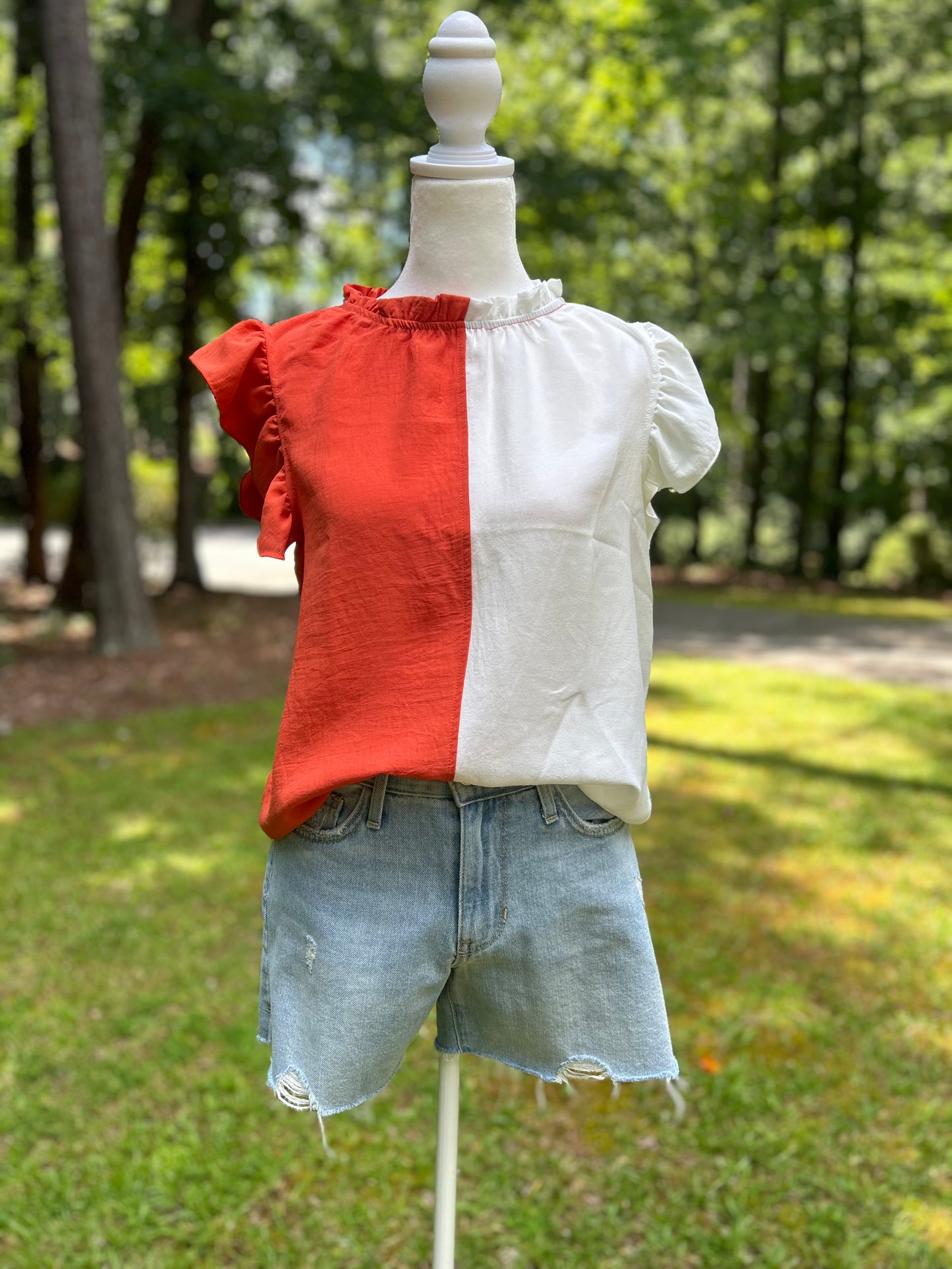 Colorblock top in orange and white.