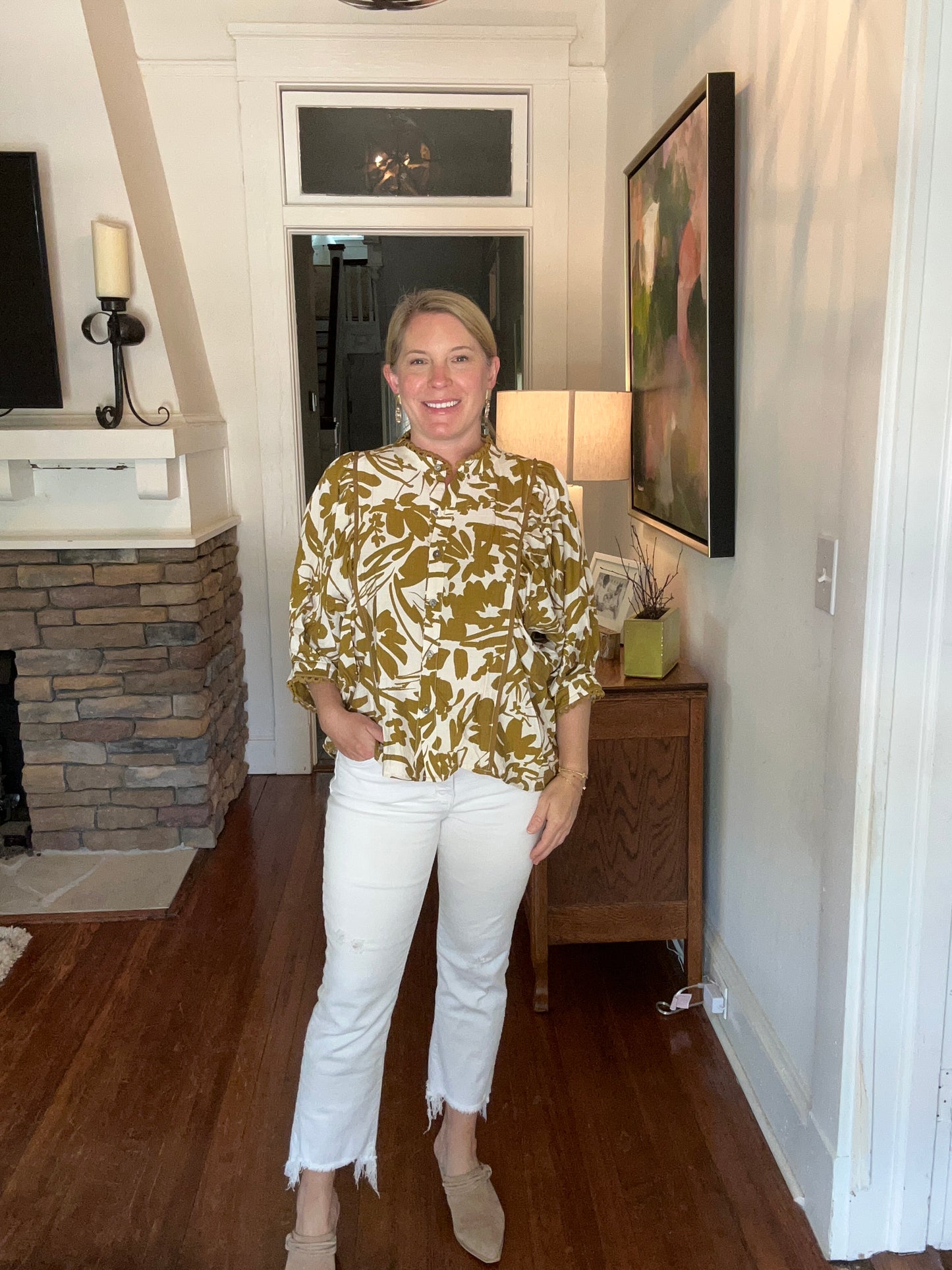 Button up front floral print top in a dijon mustard color. Scallop details on the collar and cuff.