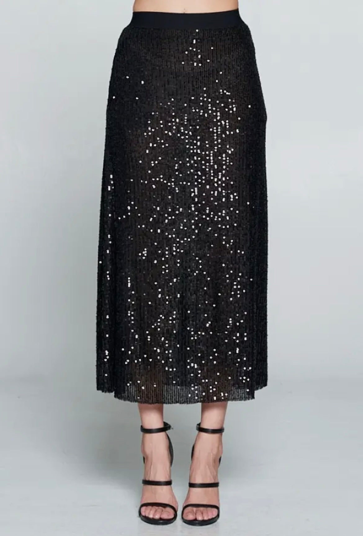 Midi length black sequin skirt with elastic waistband and pockets