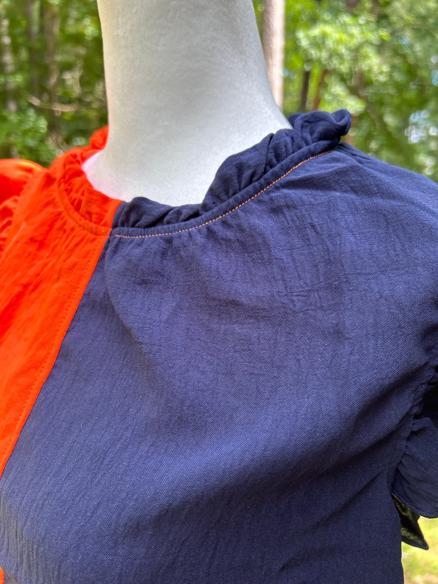 Navy ruffle sleeve and neckline top