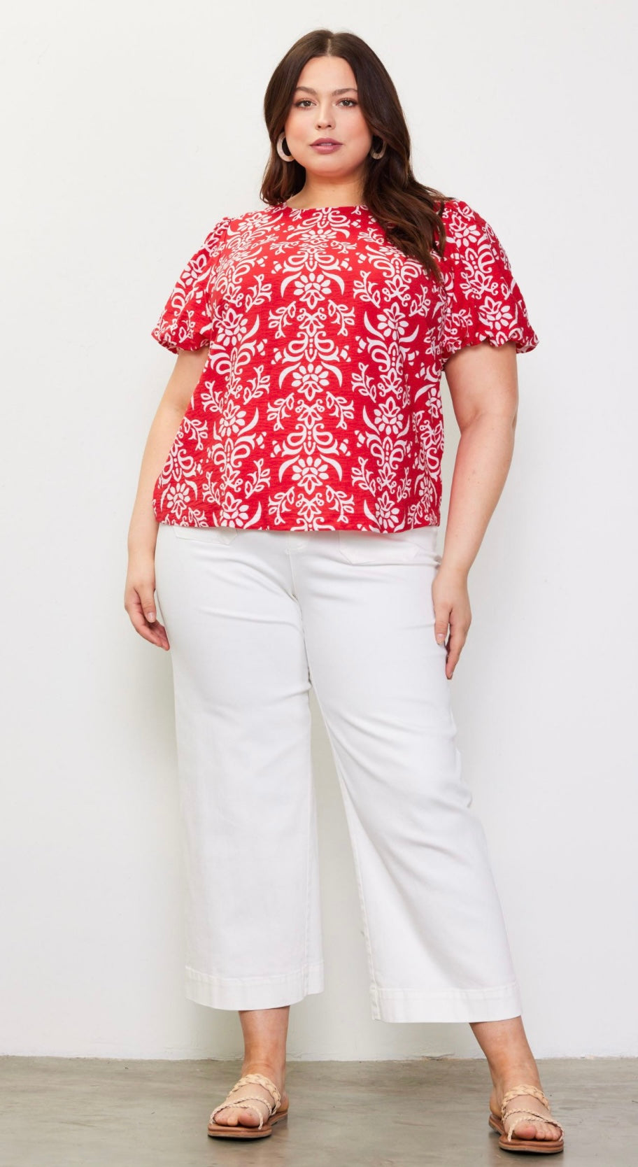 Plus size red and white printed blouse with puff sleeves and bow-tie detail at back neckline
