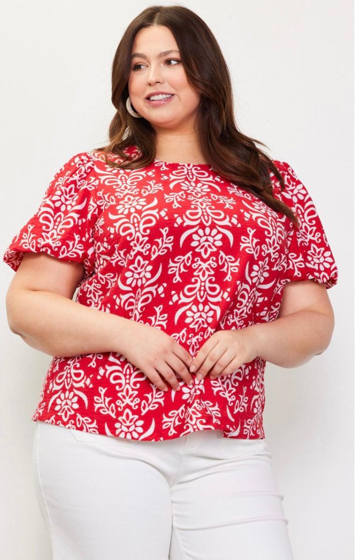 Plus size red and white blouse with puff sleeves and a tie detail at the back neckline