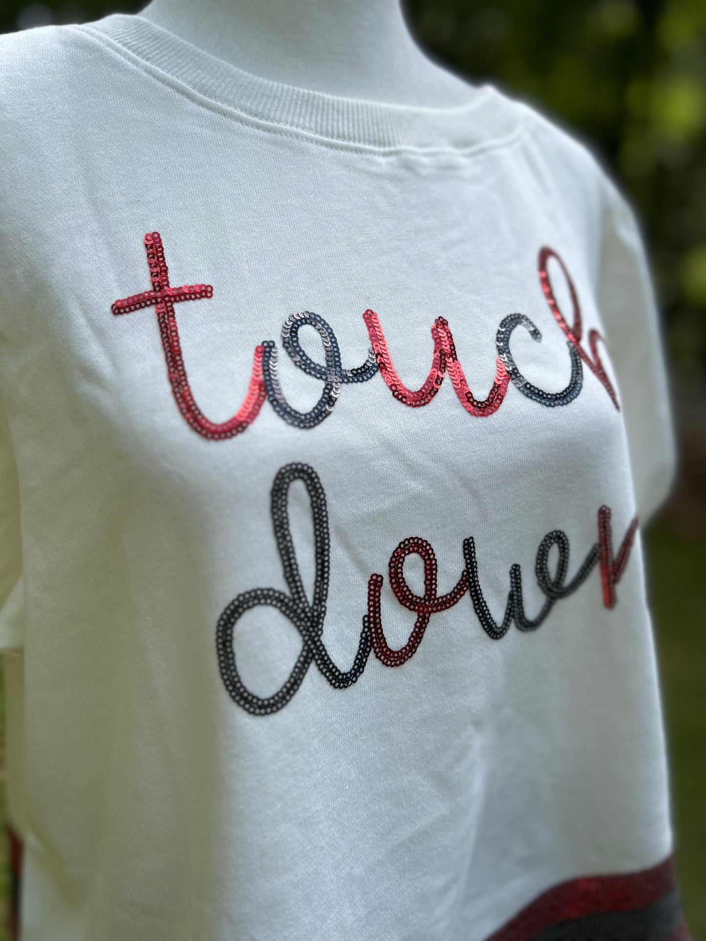Red and black sequin top spelling out Touch down with sequin scallop hem