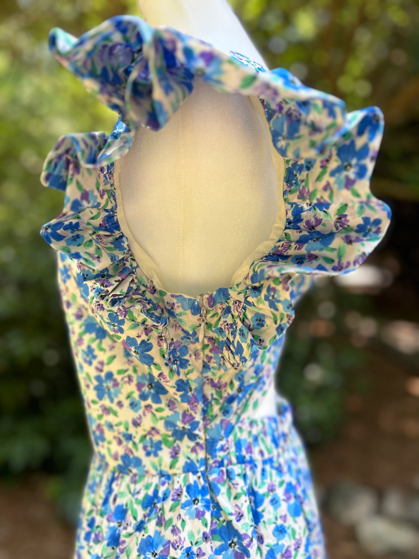 Side detail on blue floral dress.