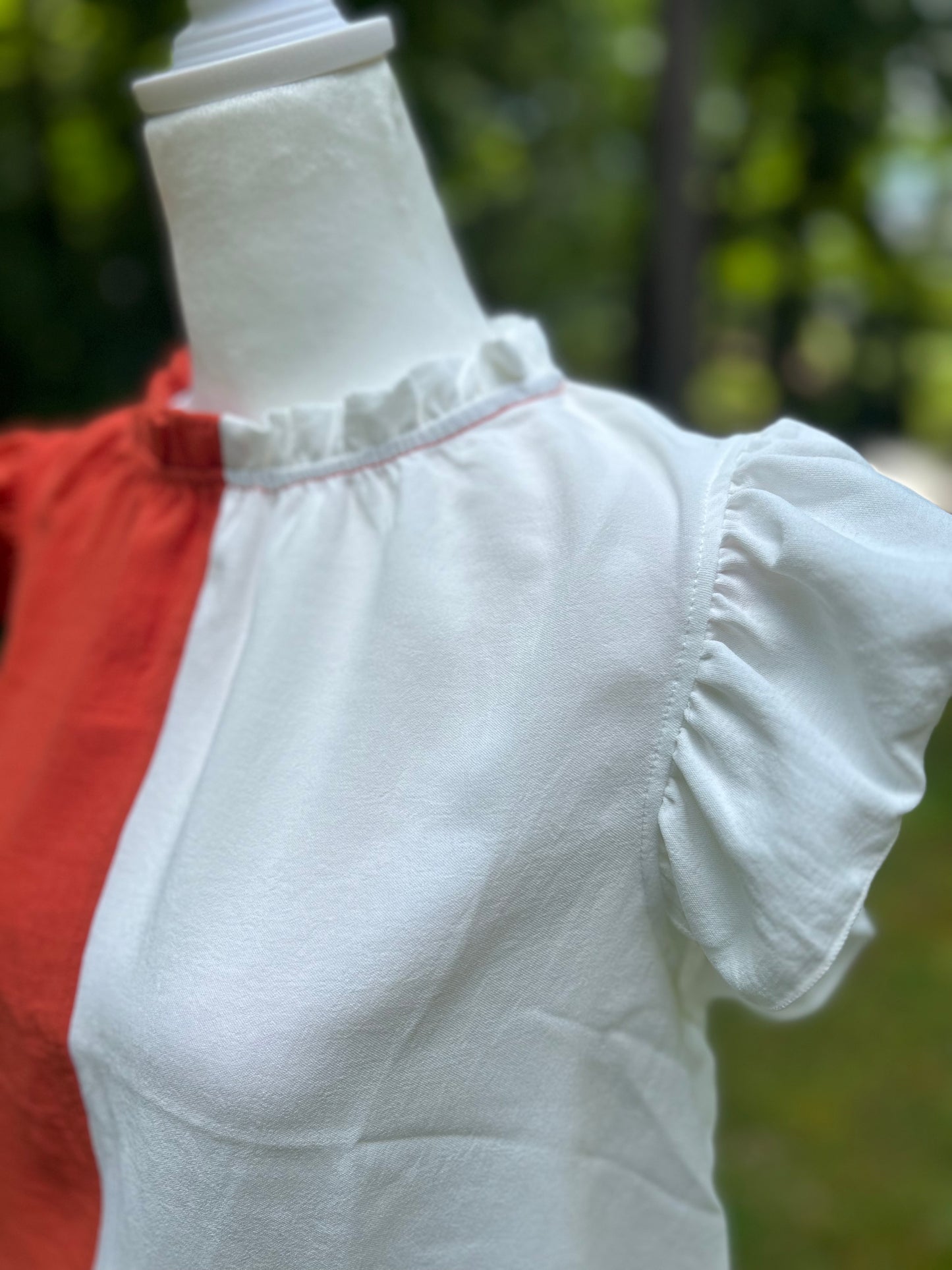 Colorblock top in orange and white