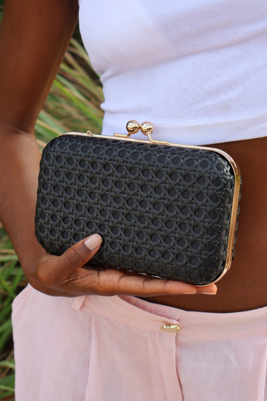 Rattan clutch with bamboo handle