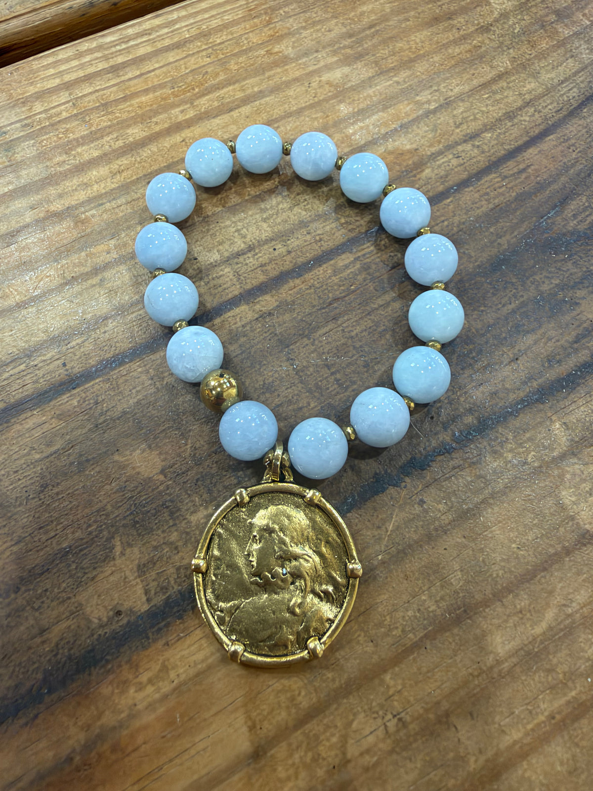Gold coin charm bracelet