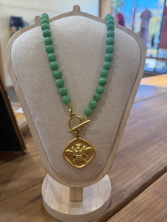 Green bee charm necklace