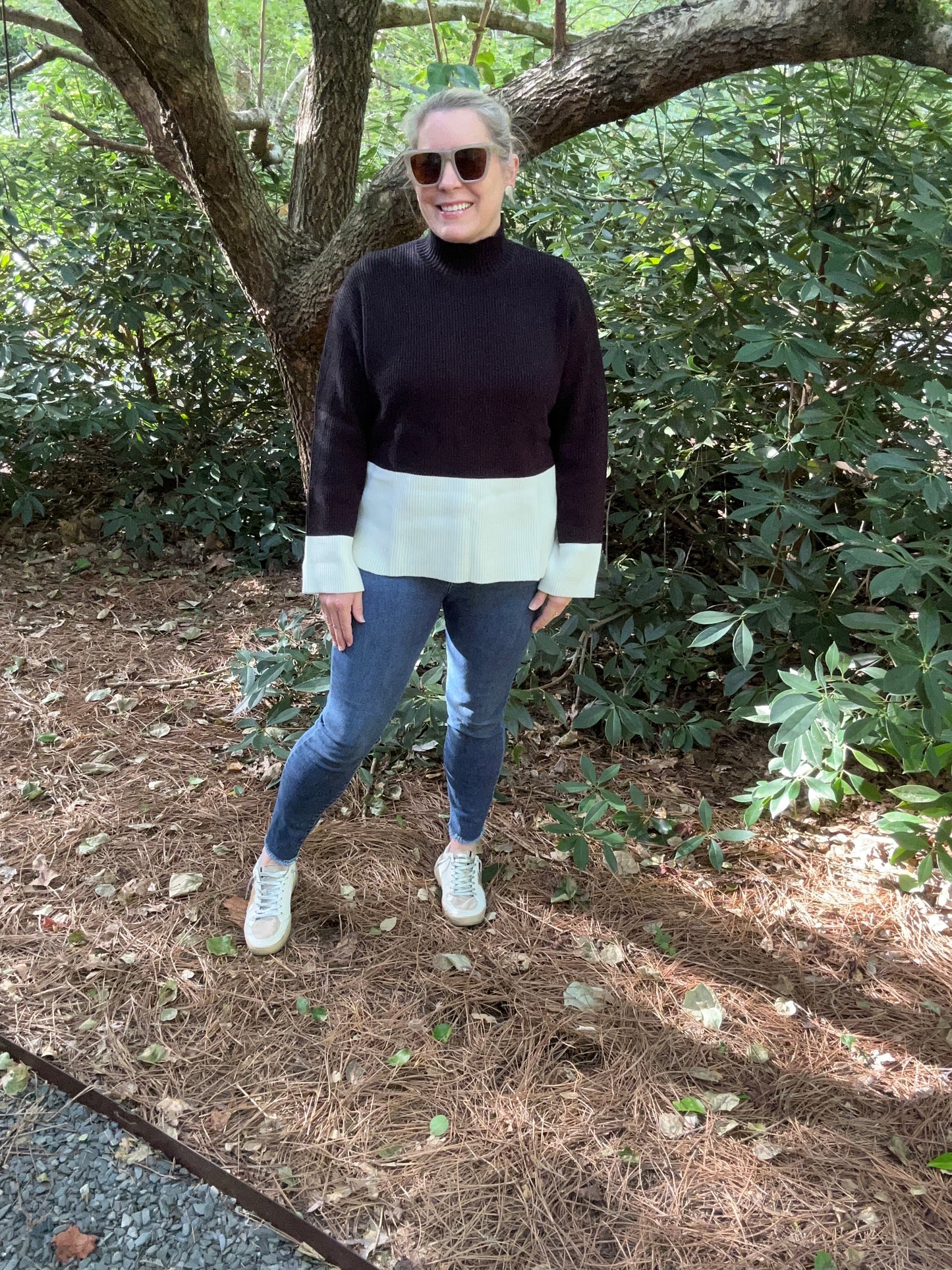 color block sweater in black and white. Mock neck and long sleeves. 