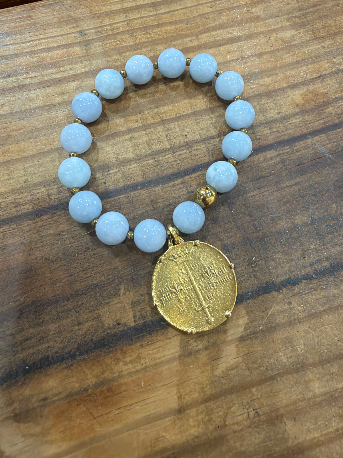 Gold coin charm bracelet