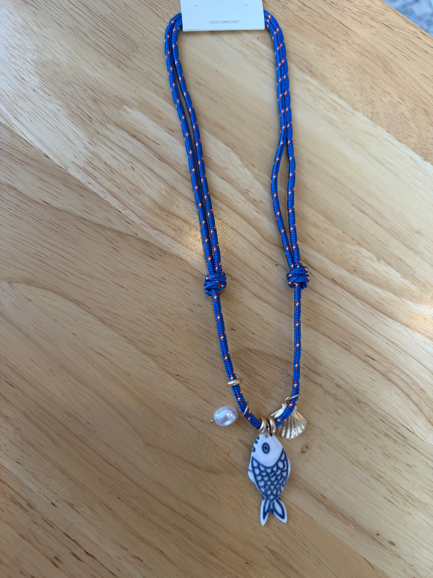 Fish on cord necklace