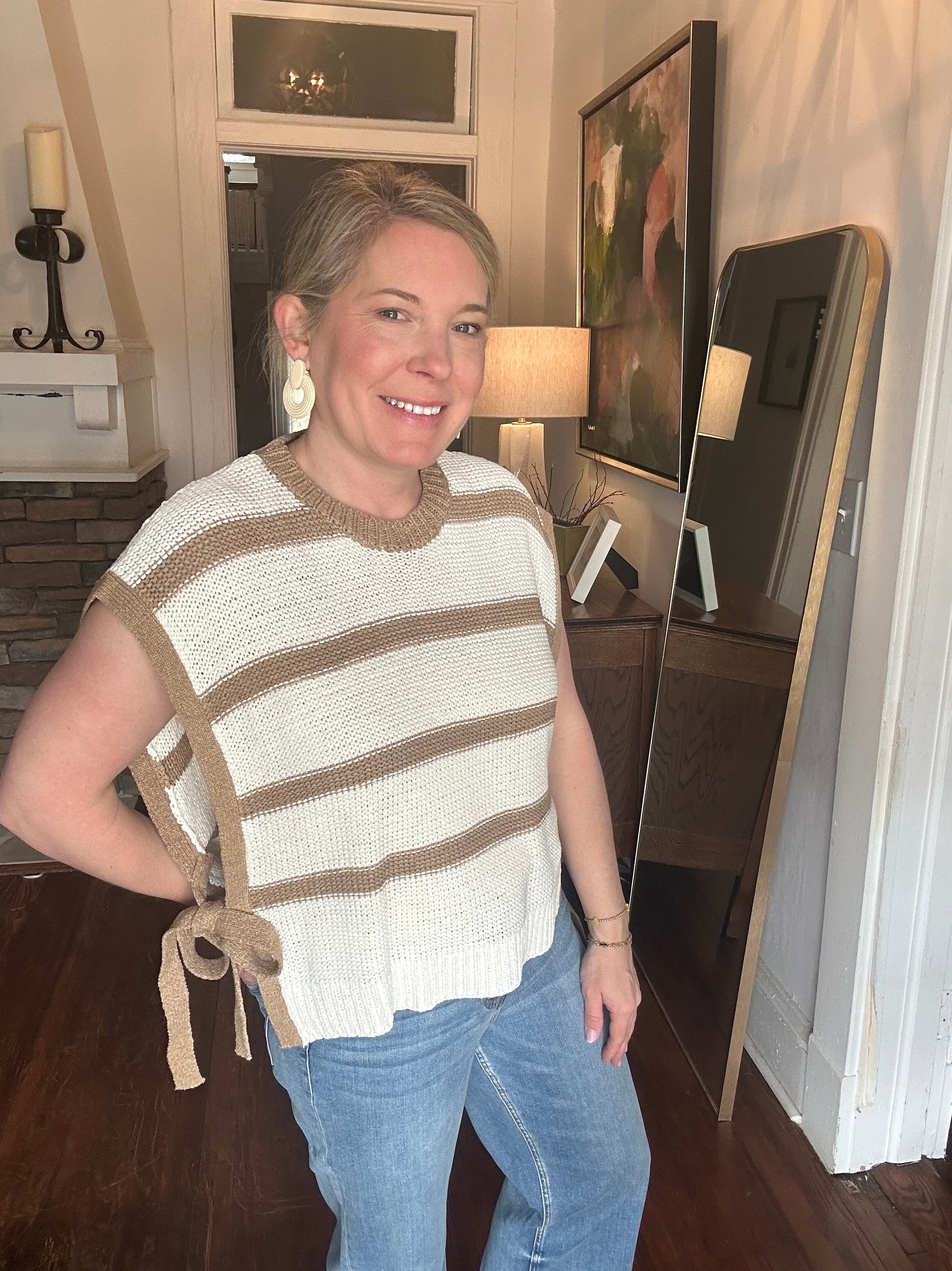 Striped vest in taupe and white, with adjustable side-ties. 