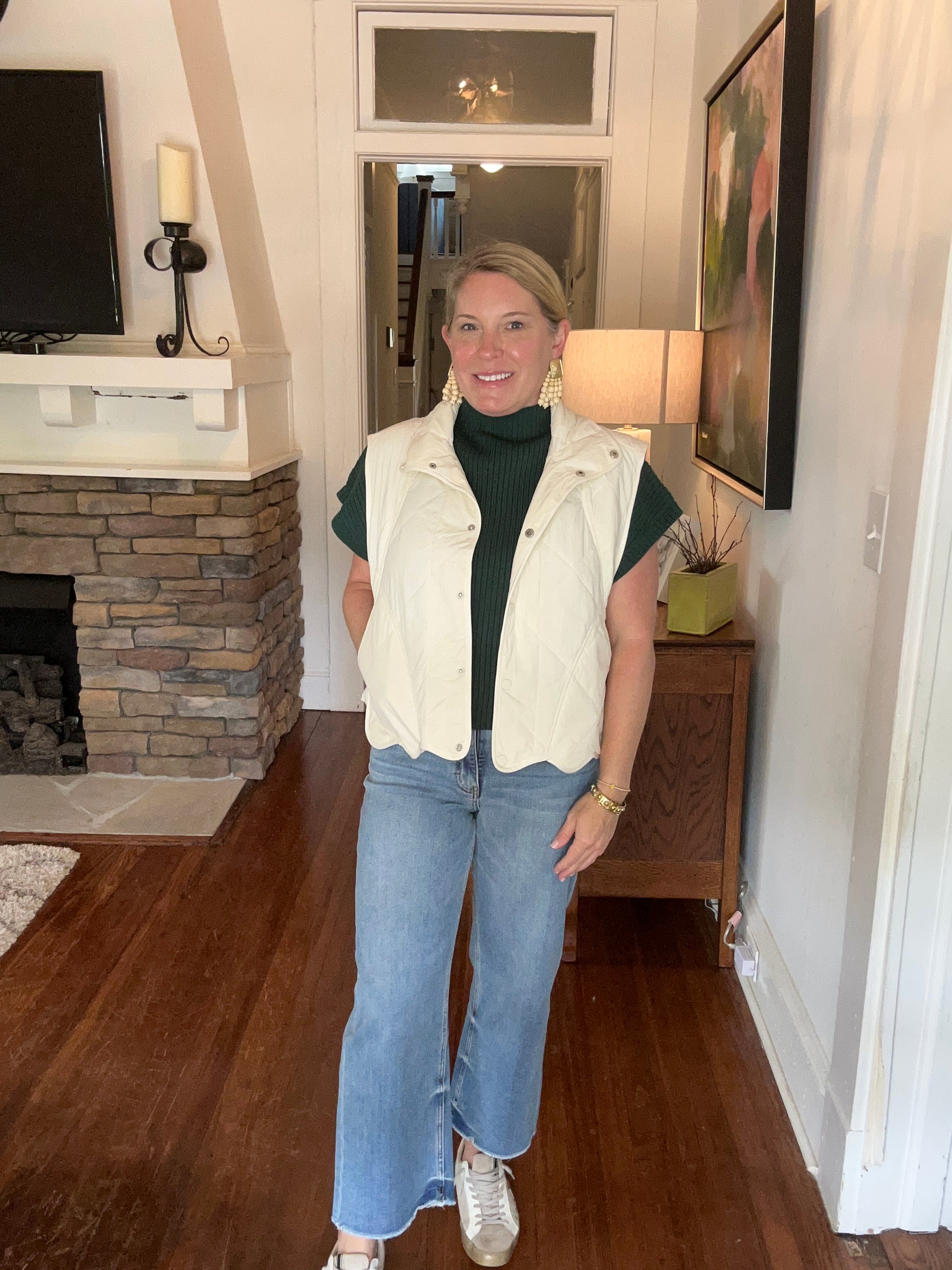 Cream quilted vest by Entro. 