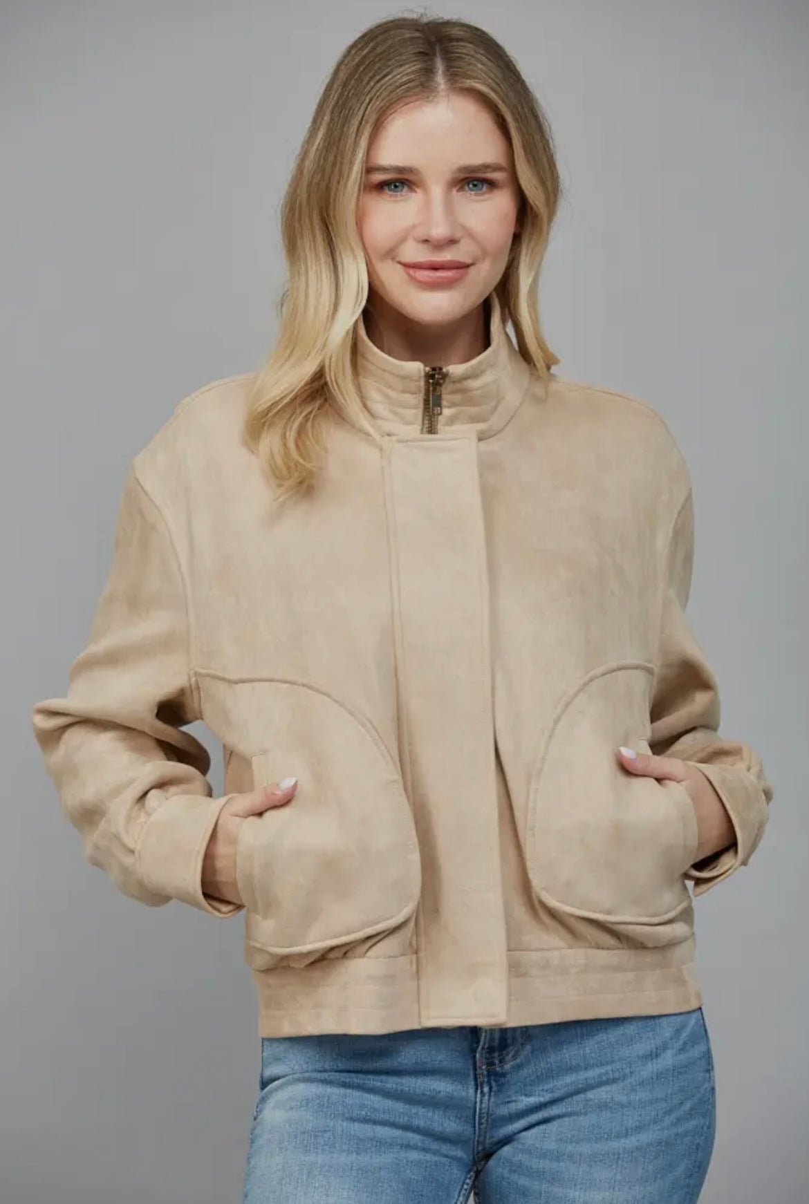 Faux suede jacket by Fate in a beige colorway. Two side pockets and zipper closure. 
