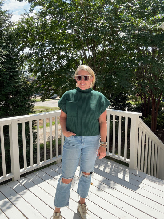 Forest Green short sleeve, slightly cropped sweater with ribbed detail and front pocket. 