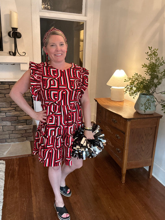 Abstract print in red, black and white with ruffle cap sleeves and crew neckline