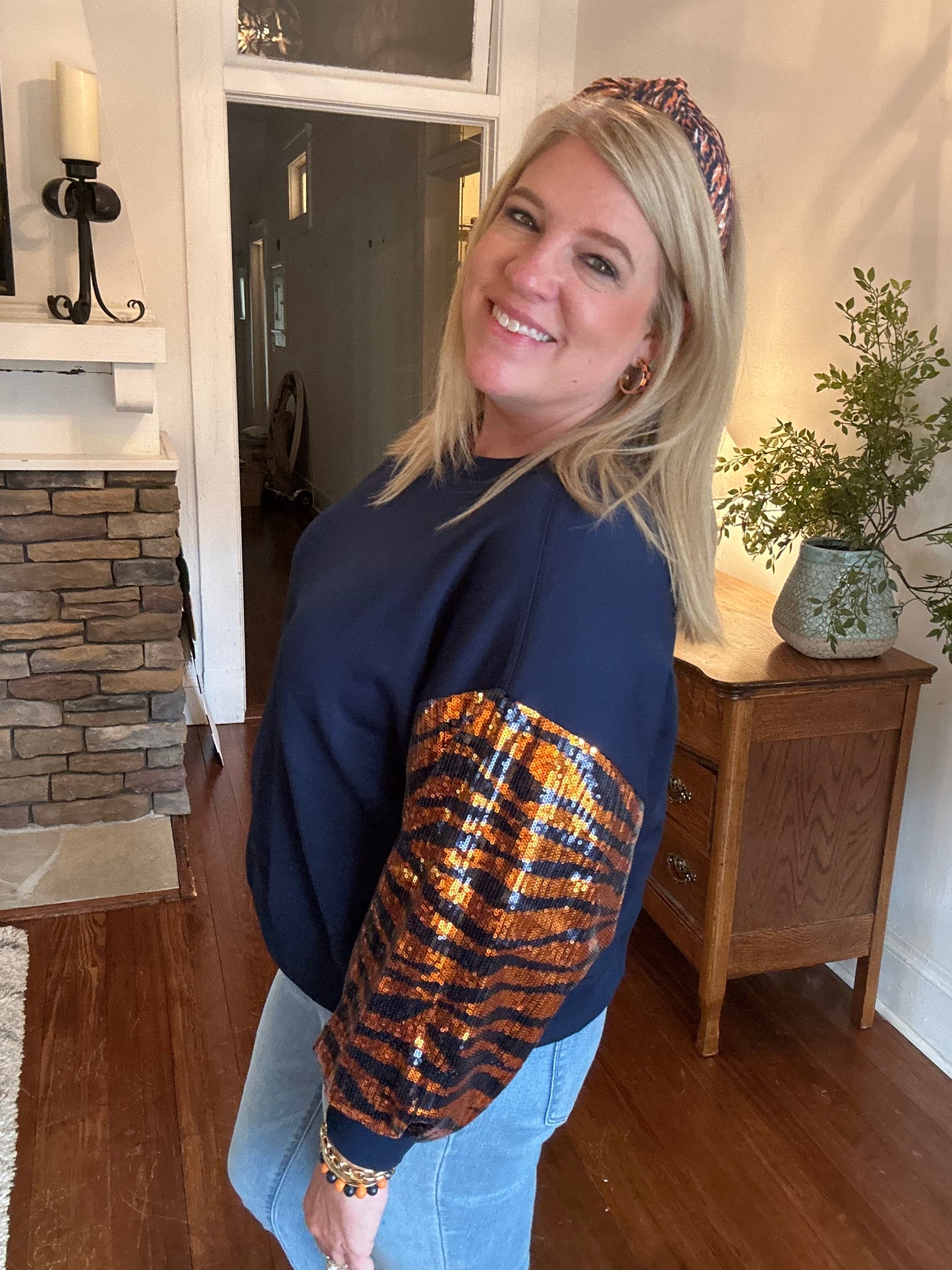 Gameday sweatshirt in navy and orange with tiger stripe sleeves. 