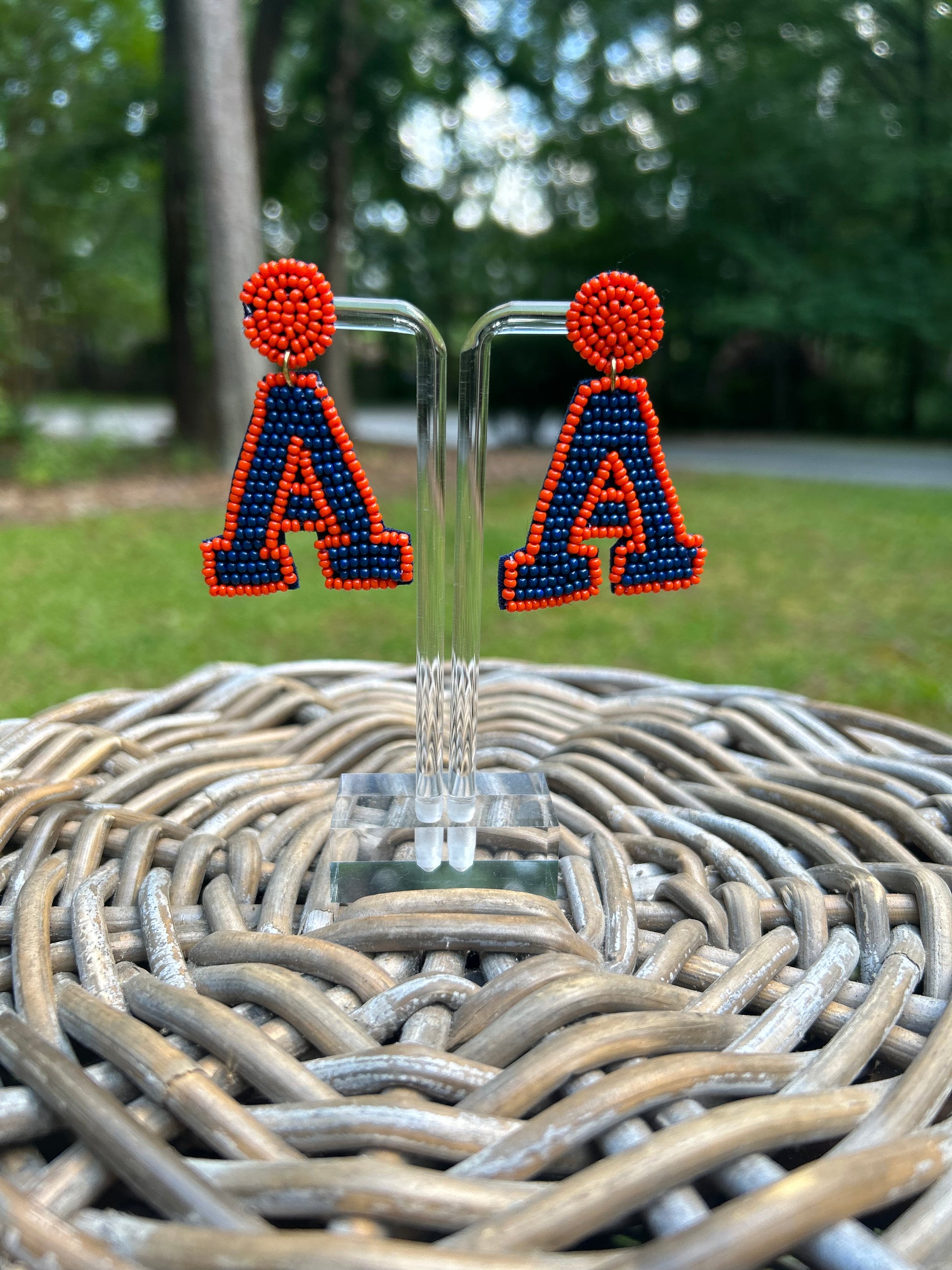 Lightweight, Auburn "A" beaded earrings in navy and orange. 