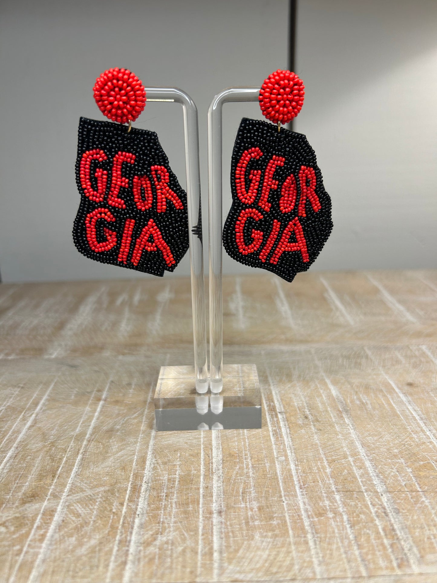 Lightweight, State of Georgia earrings with a black background and red beads spelling out Georgia. Perfect for cheering on the University of Georgia. 