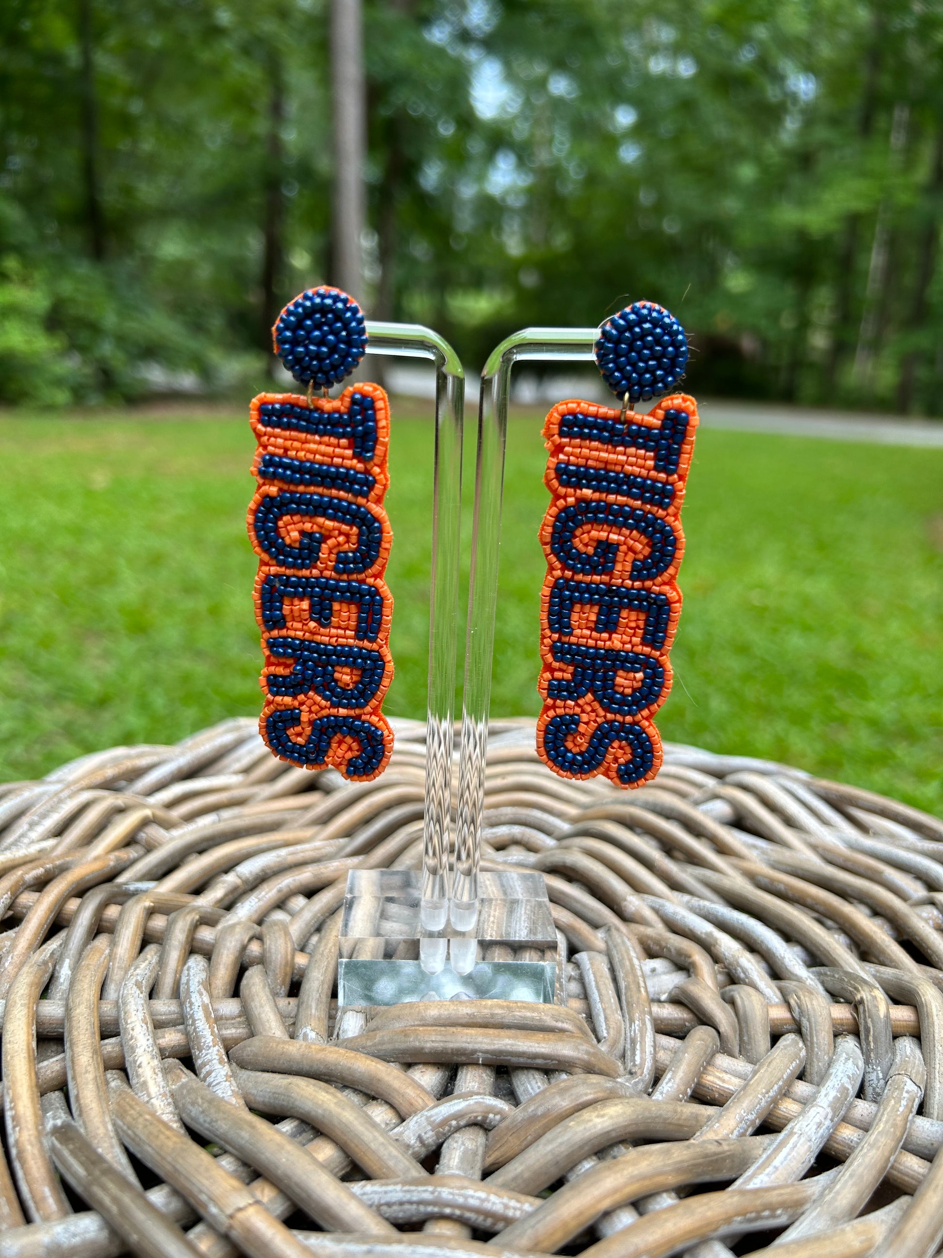 Lightweight, beaded earrings that spell out Tigers in navy with an orange border. 