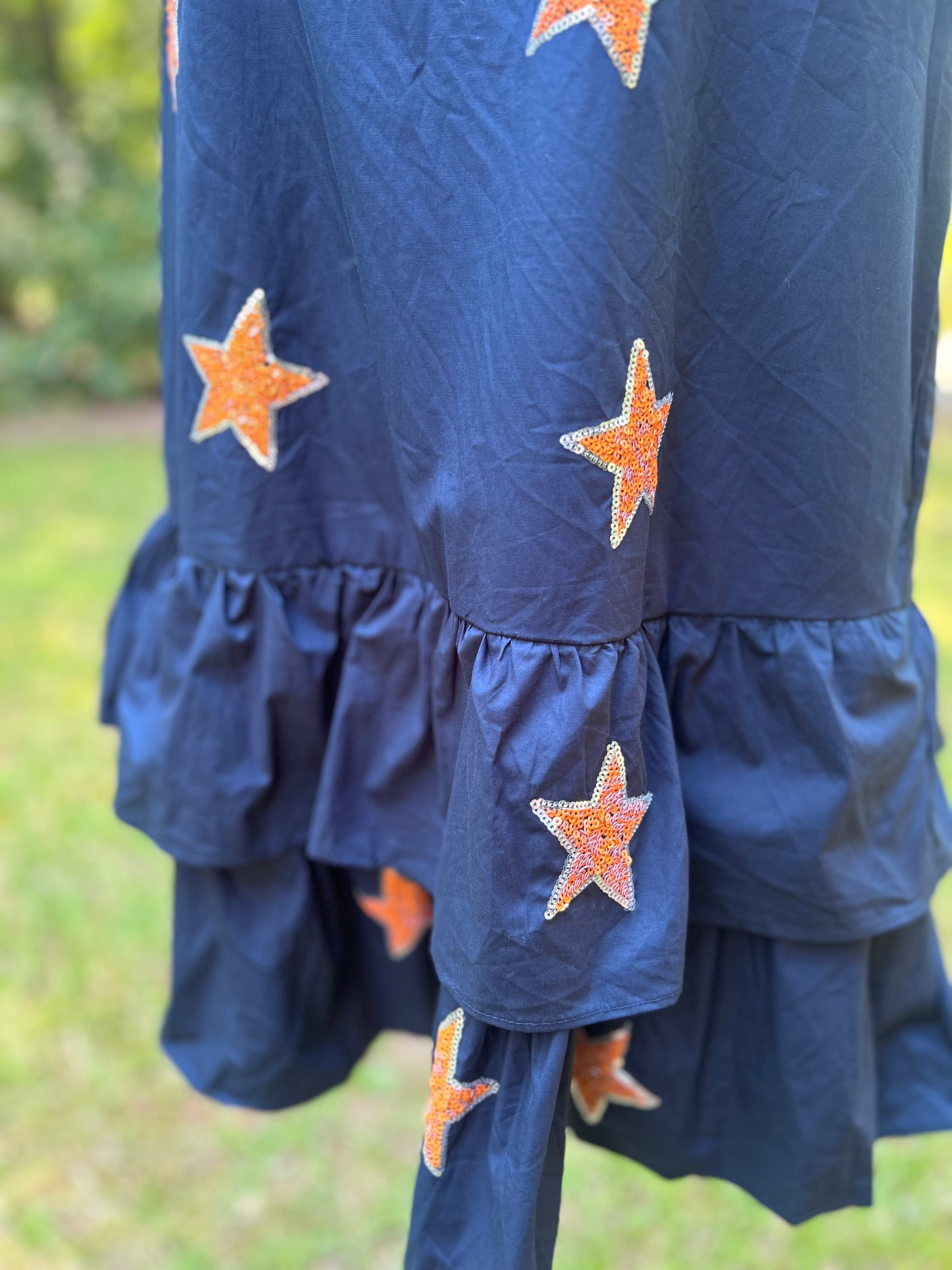 Navy and orange star sequin dress. 