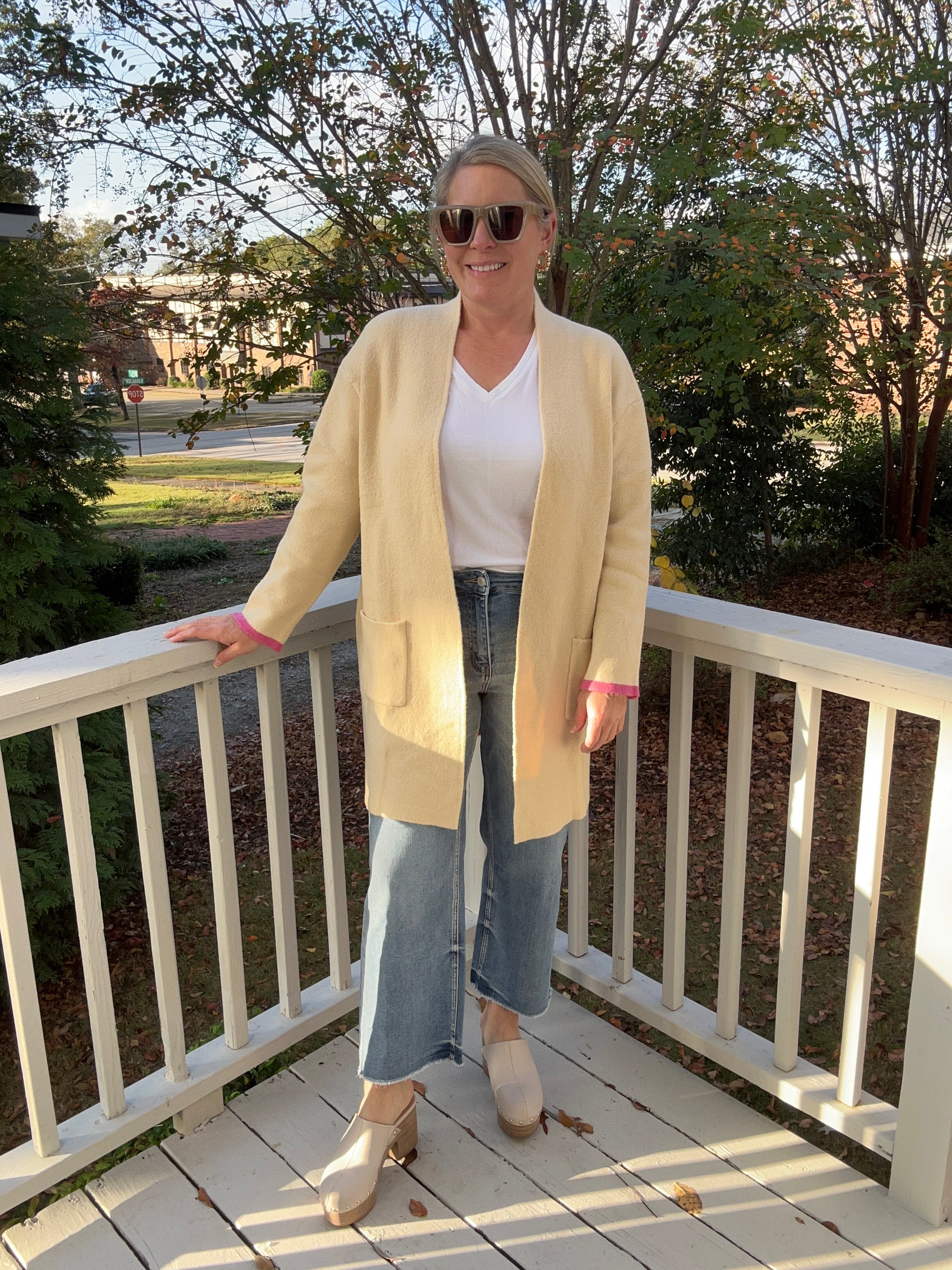 Cream open front cardigan with pink and orange stripe detail on the back by thml