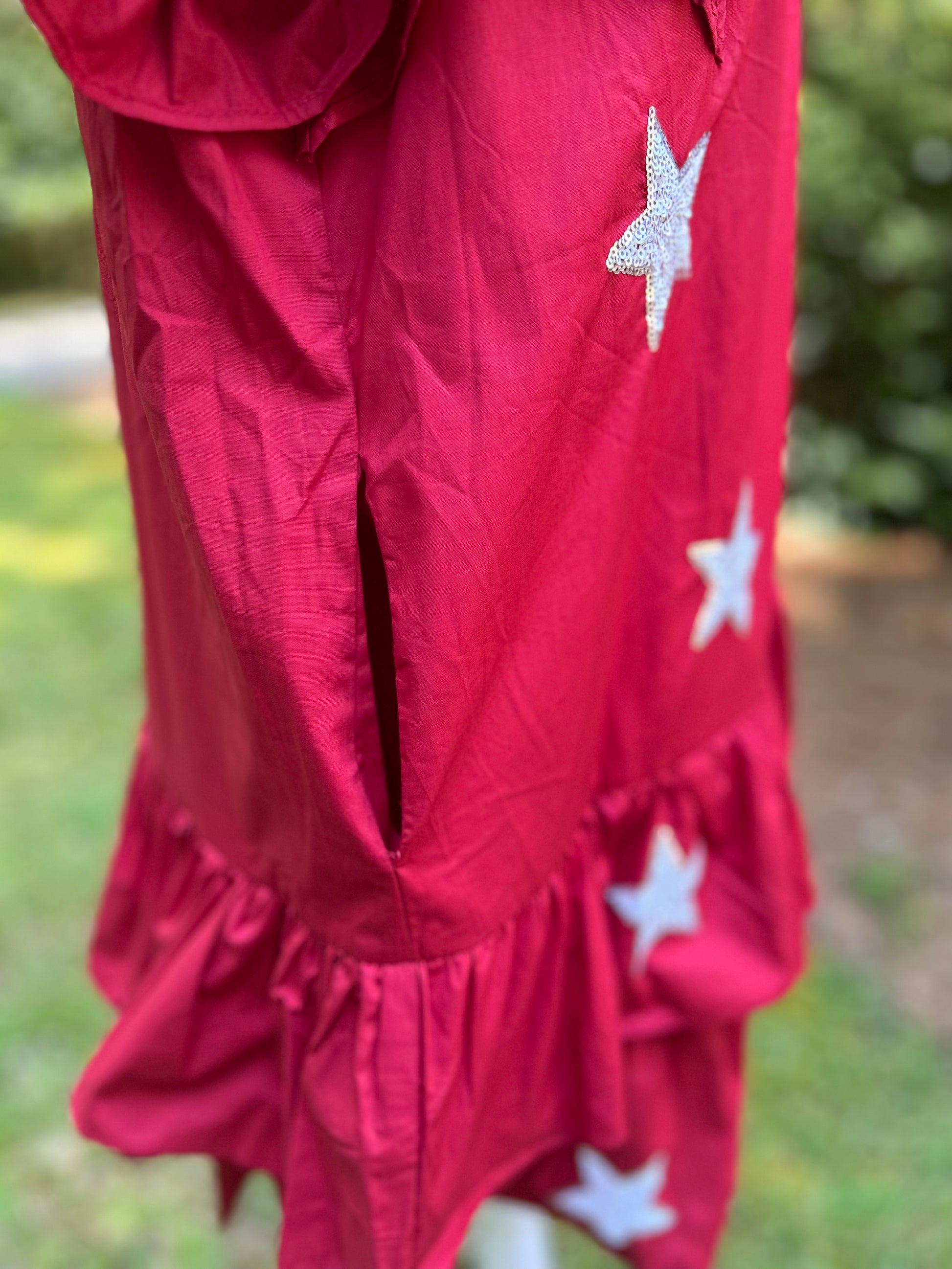 Ruffled crimson dress with star sequins