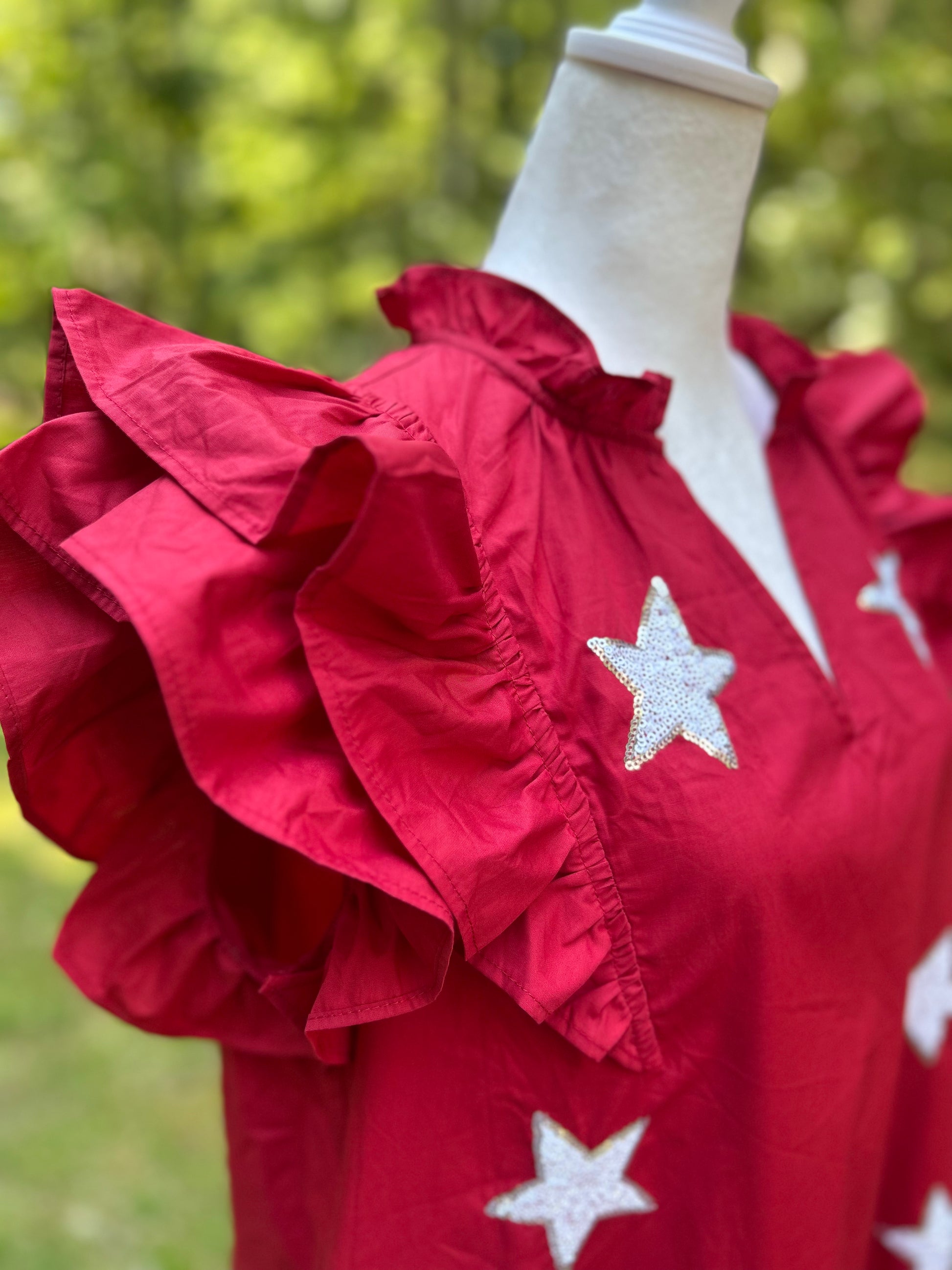 Ruffled dress in crimson with white sequin stars