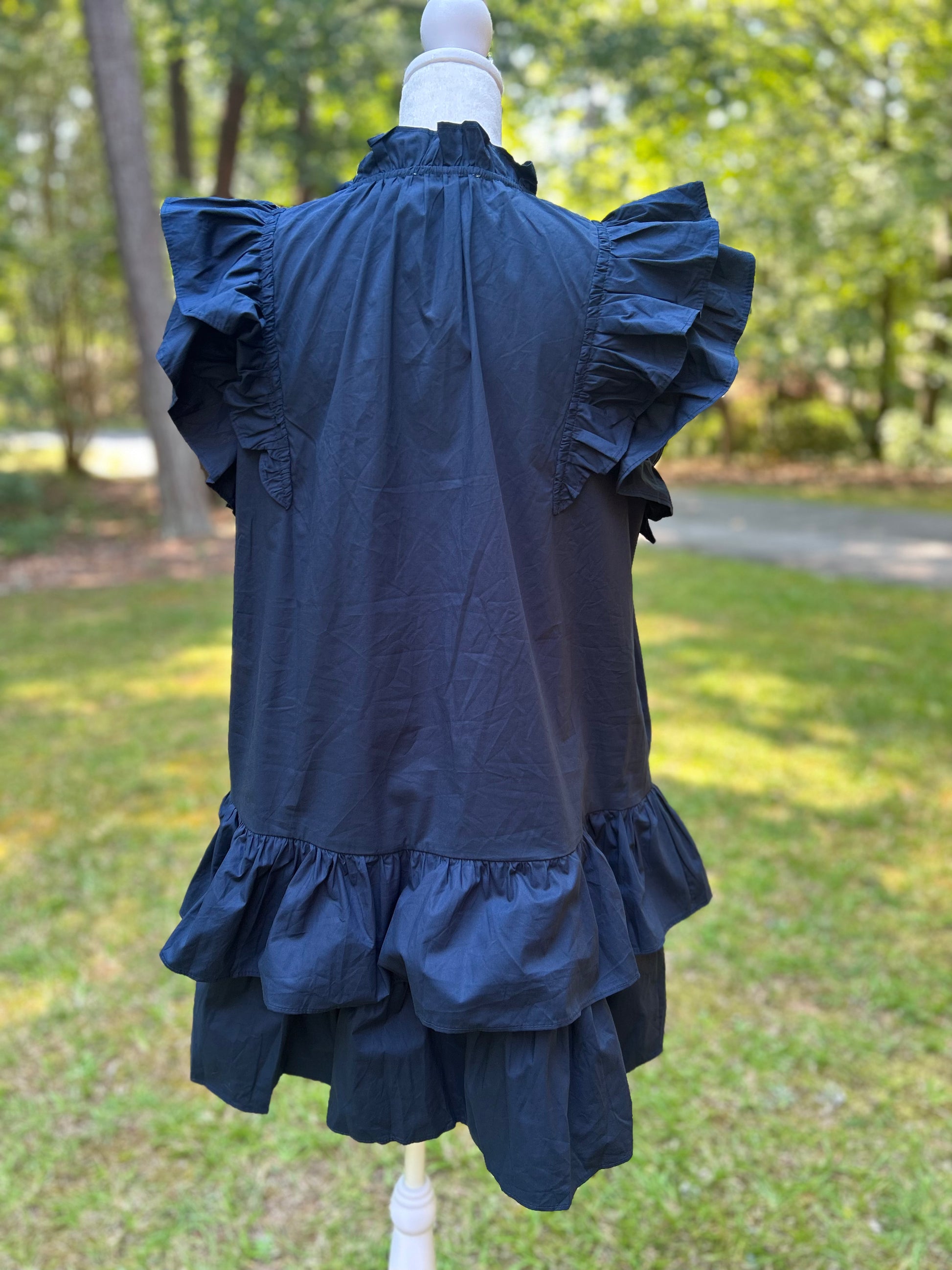 Ruffled navy dress with orange sequin stars