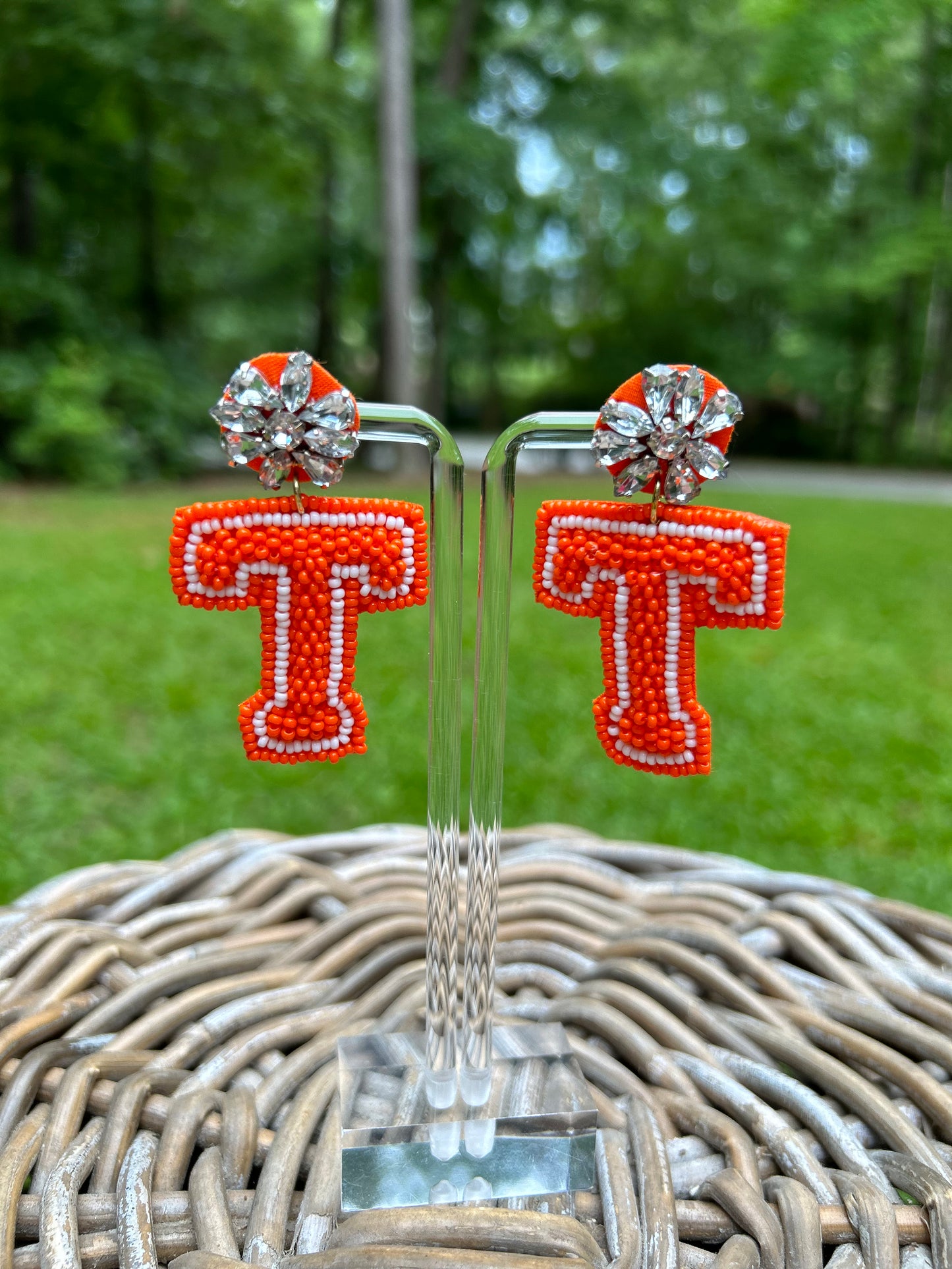 Lightweight, beaded Tennessee "T" earrings in orange and white. 