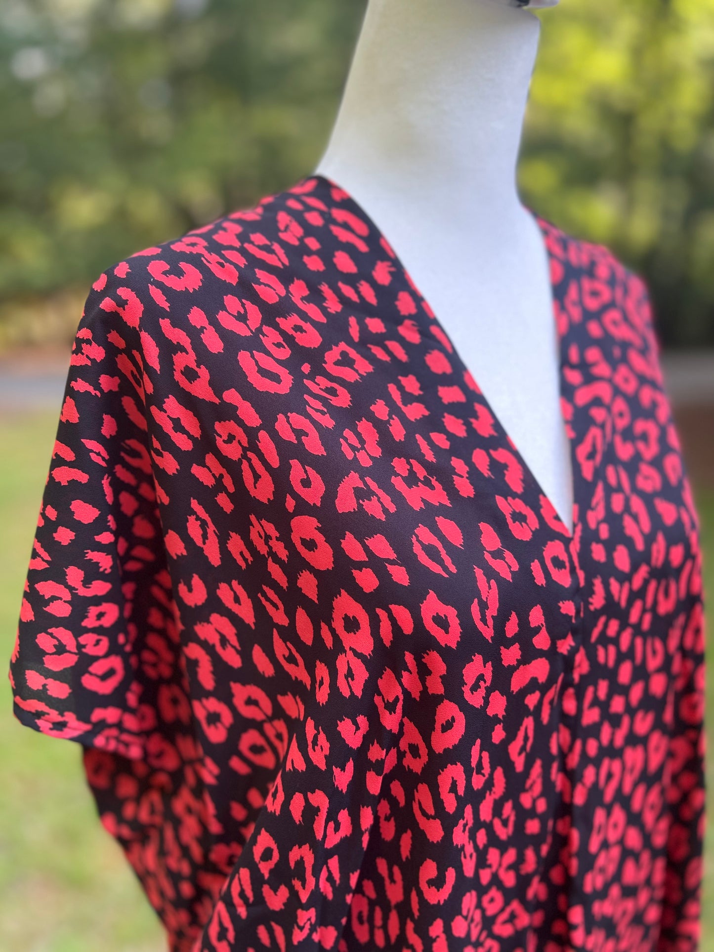 V-neck top in red and black leopard print