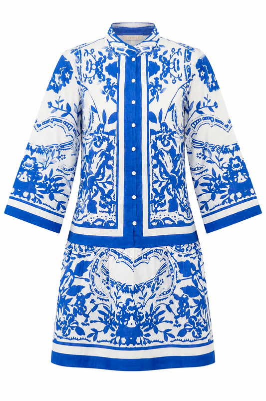 Blue and white patterned dress on a white background